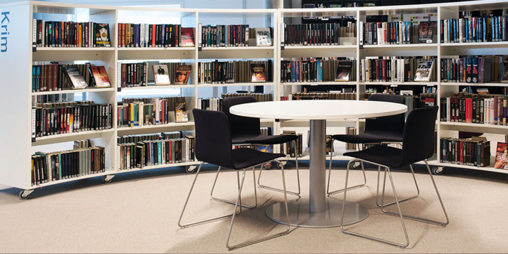 Forum breakout table in library with Moon meeting chairs