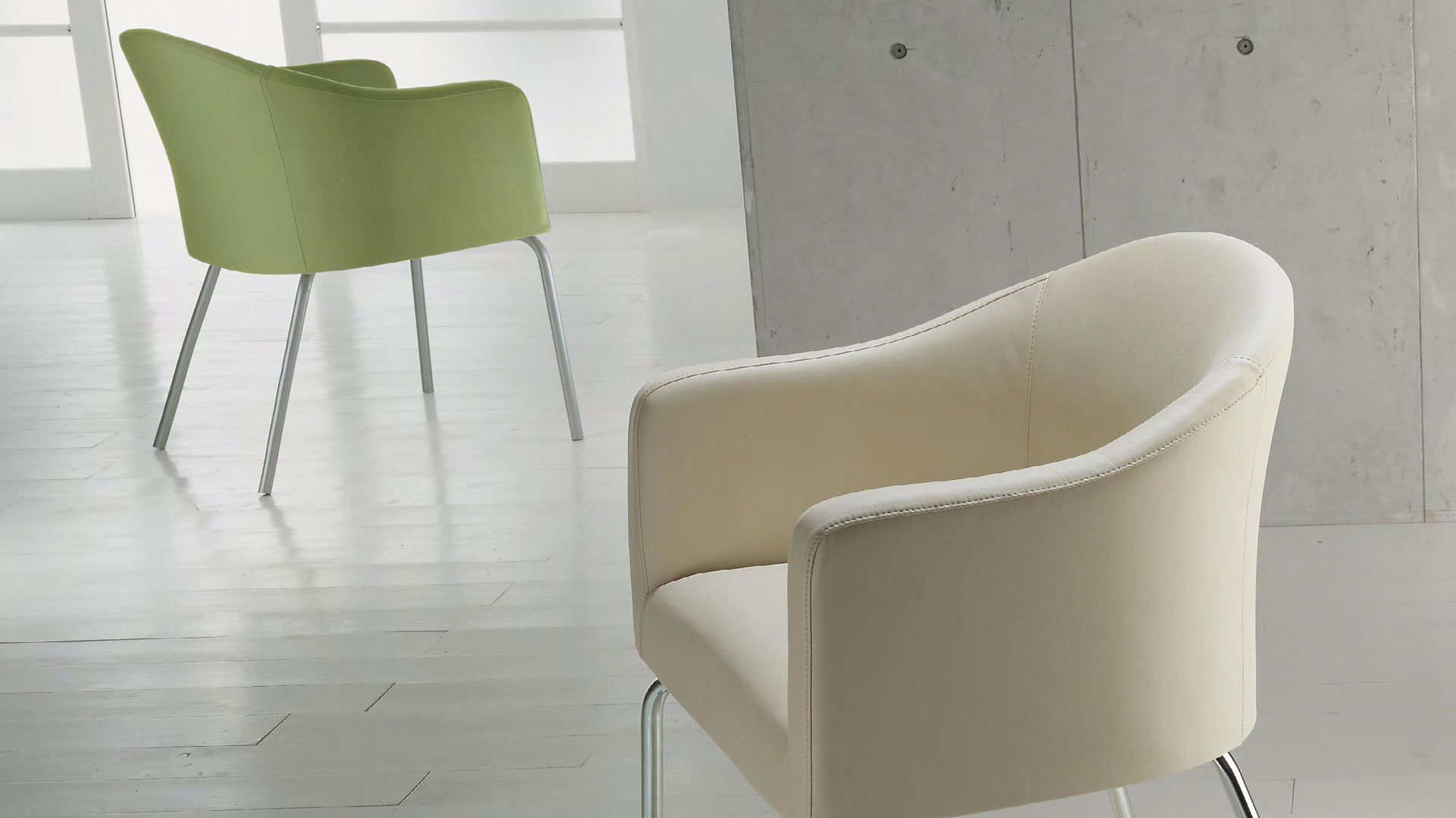 Luna armchairs are available in a range of fabrics including genuine leather