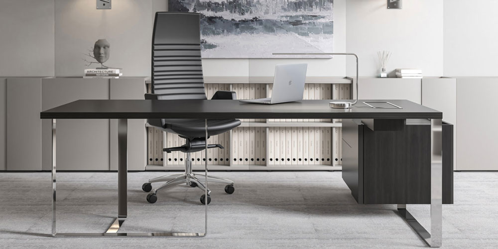 PLANA executive desk with grey wood top and chrome legs.