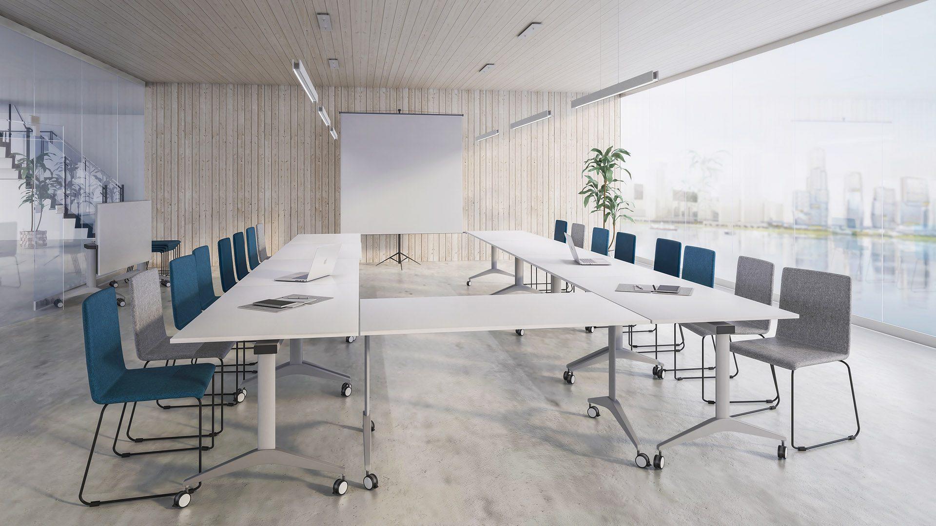 Sled base Moon conference chairs with flip-top tables in training room layout