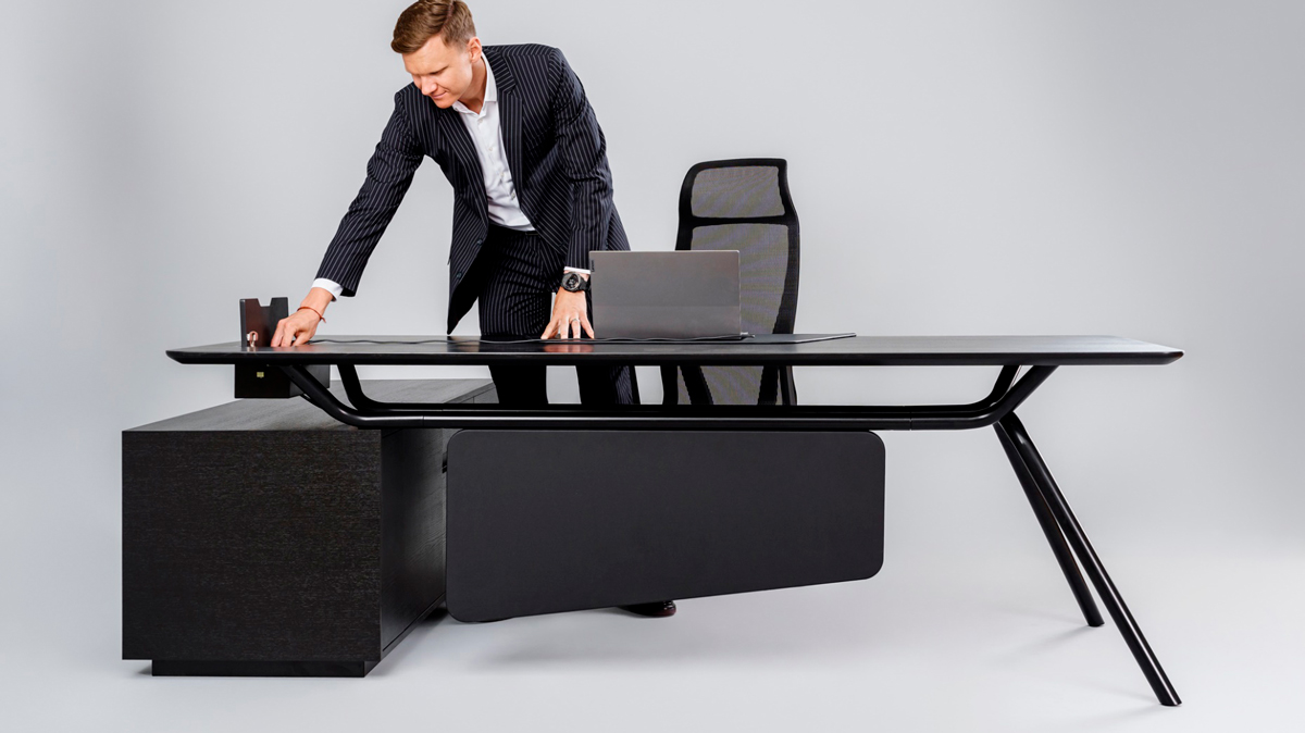 Arqus executive desks offer combined storage pedestals and leather finish modesty panels