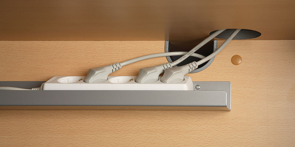 Cable tray in silver with multiplug.