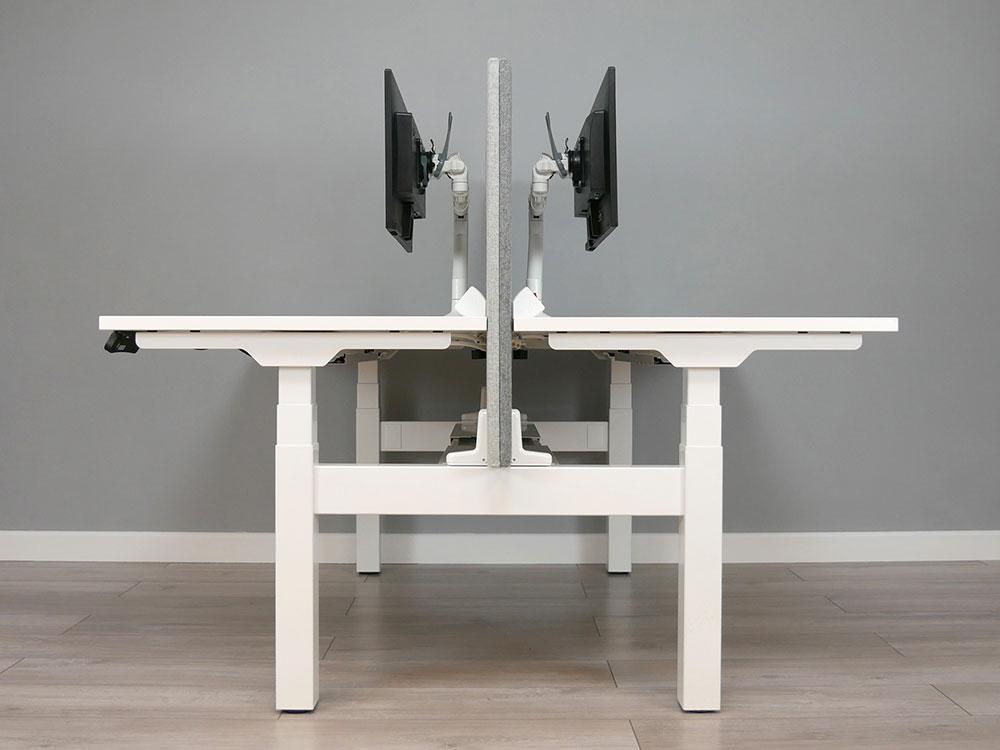 Alto 2 back to back bench desks with universal screen brackets and adjustable central cable tray.