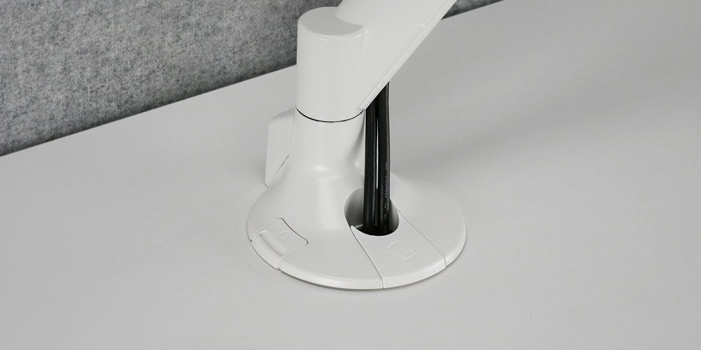 Flexible base design for through-desk cable management.