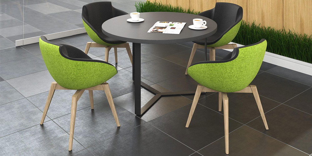 Tula lounge chairs in green and black fabric with Plana round meeting table