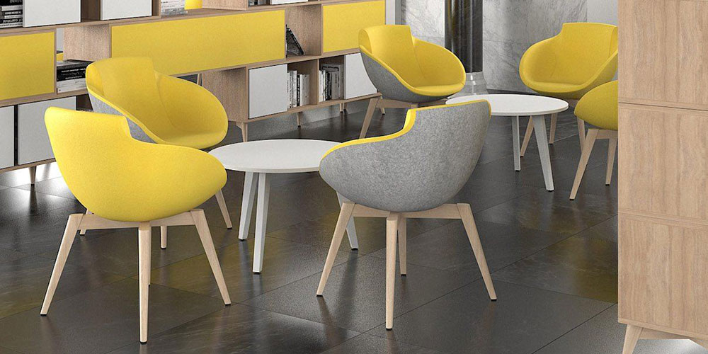 Create distinct breakout meeting spaces with Tula double-sided upholstered lounge chairs