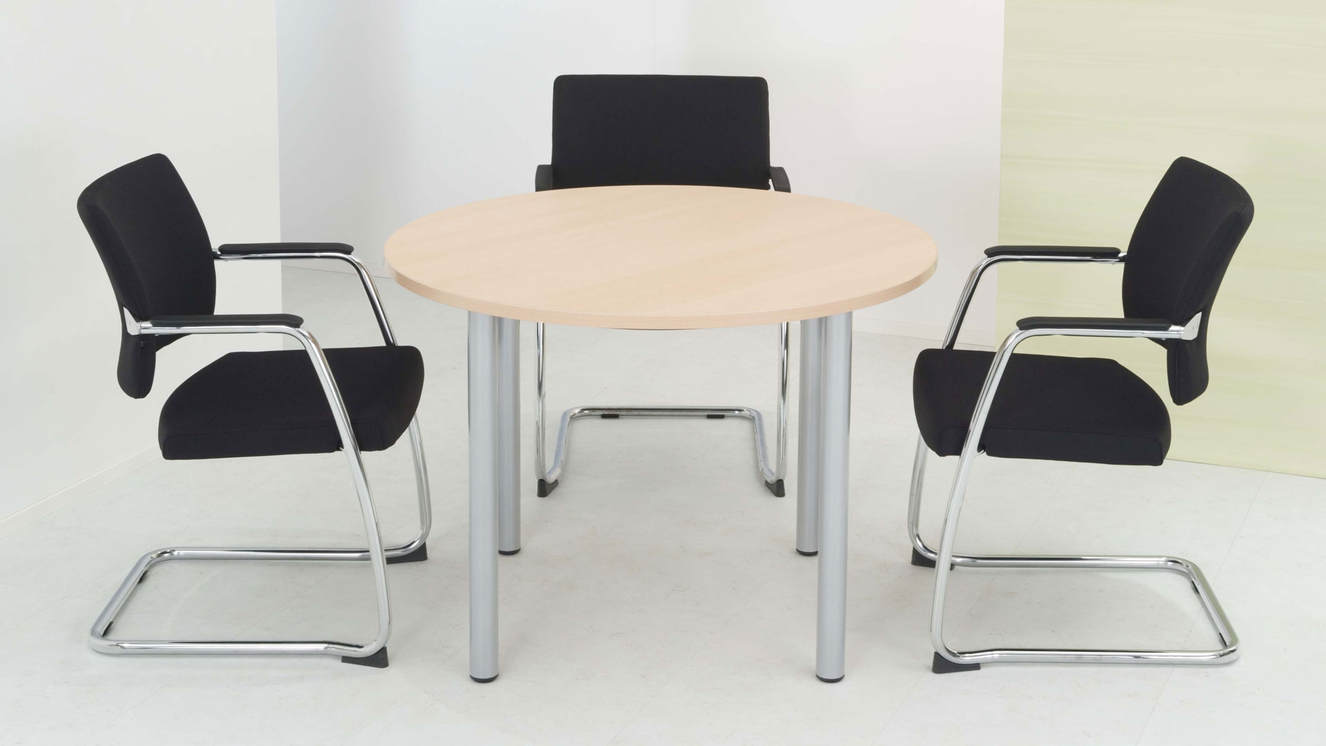 Optima round meeting table with pole legs